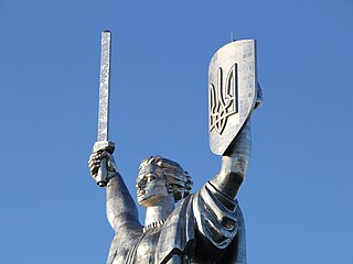 the modified  motherland statue, now with the Ukrainian trident on the shield